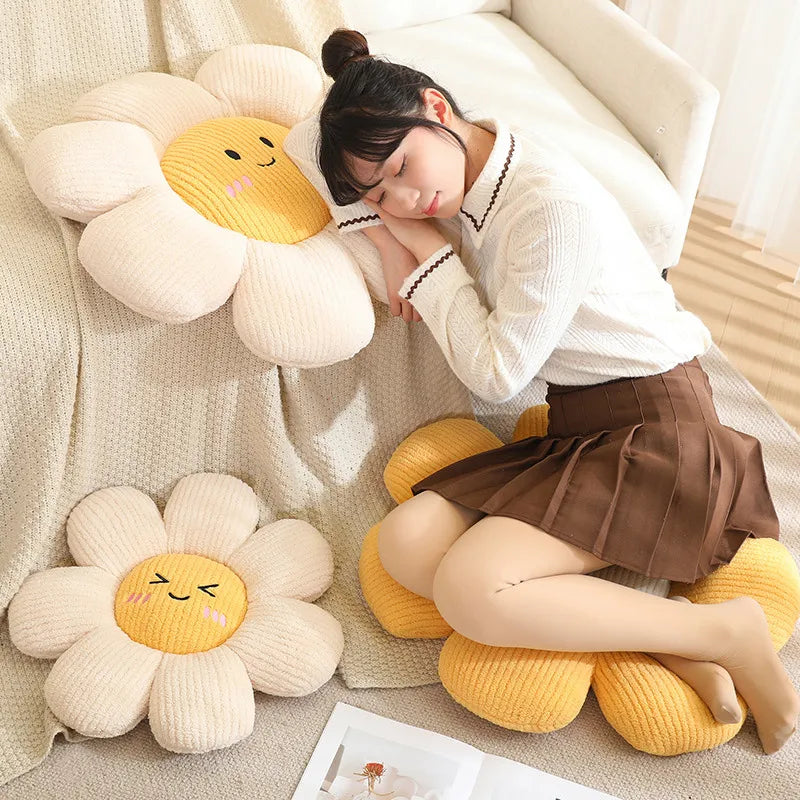 Woman lying on a bed with sunflower-shaped kawaii cushions