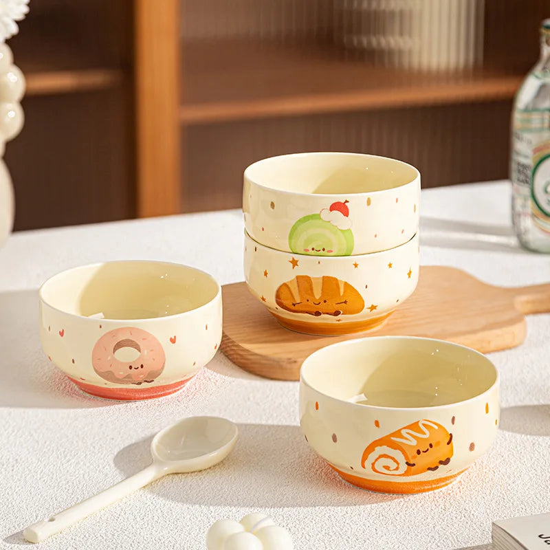 A group of four cartoon designed kawaii bowls sitting on a table