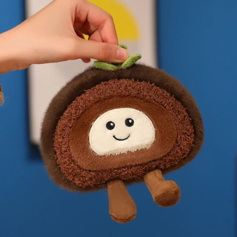 Kawaii plush toy resembling a brown snail with a smiling face held by a hand against a blue background.