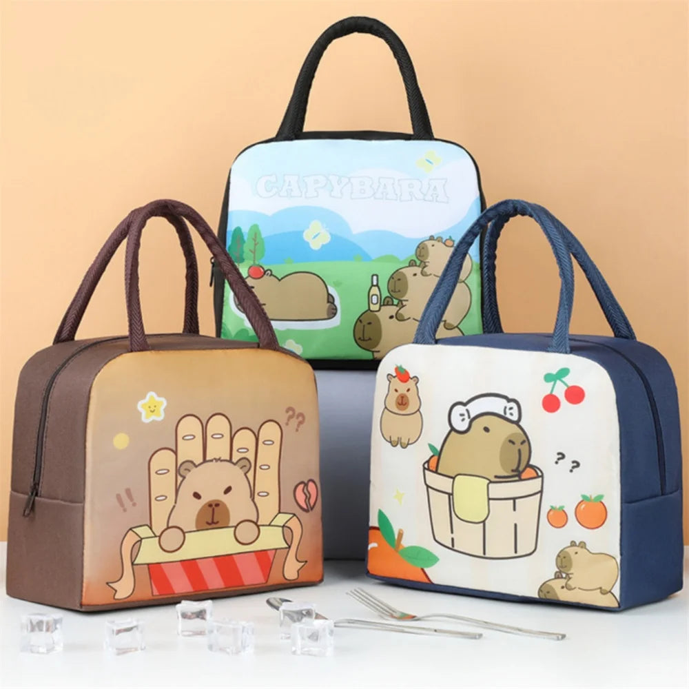 Three cartoon-themed kawaii lunch bags on a beige background