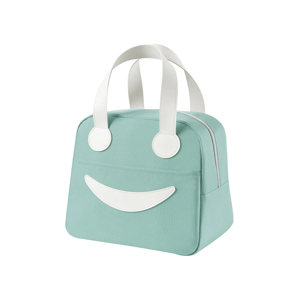 Light blue kawaii lunch bag with white handle and smiley face design on a white background