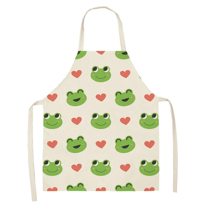 Children's kawaii apron with green frog and red heart pattern on a white background