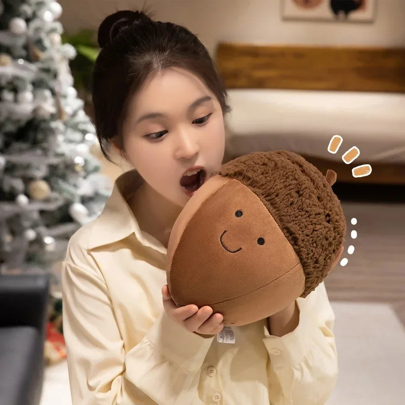 Child holding a kawaii plush toy resembling a brown acorn with a smiling face, in a cozy indoor setting.