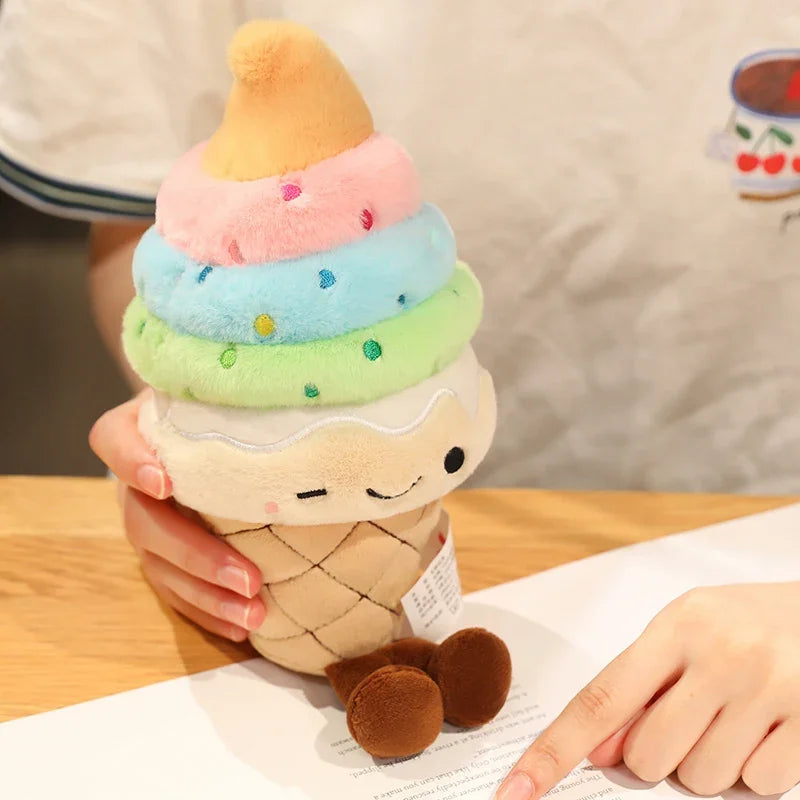 Kawaii plush toy resembling a stack of ice cream with a smiling face held by a person.