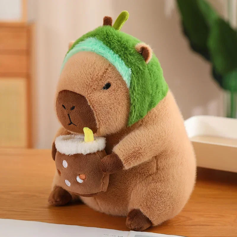 Kawaii plush toy resembling a bear with a green hat on a wooden surface