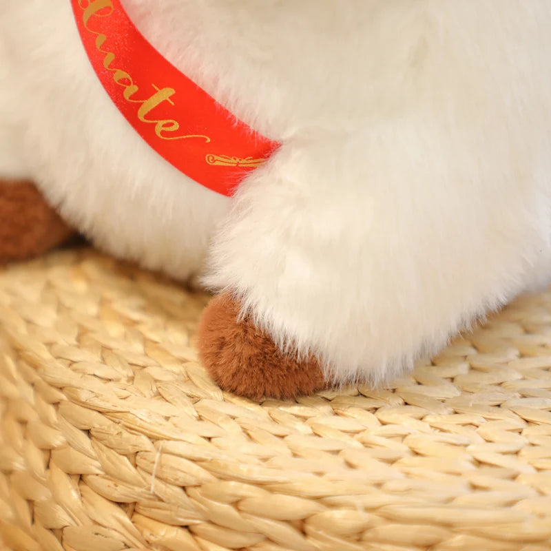 Close-up of a capybara plush toy with a red label on a woven surface