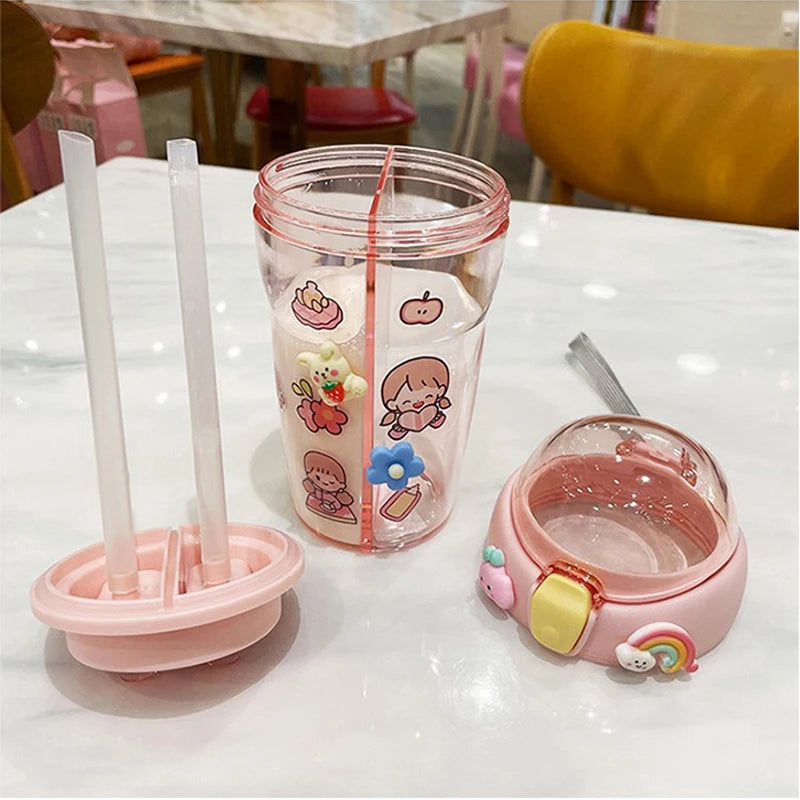 Pink kawaii tumbler with cartoon designs on a table