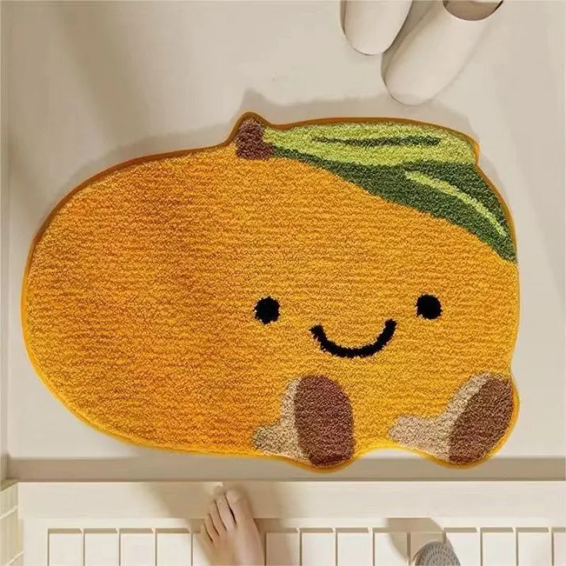 Cute pumpkin-shaped kawaii doormat with a smiling face on a white floor.