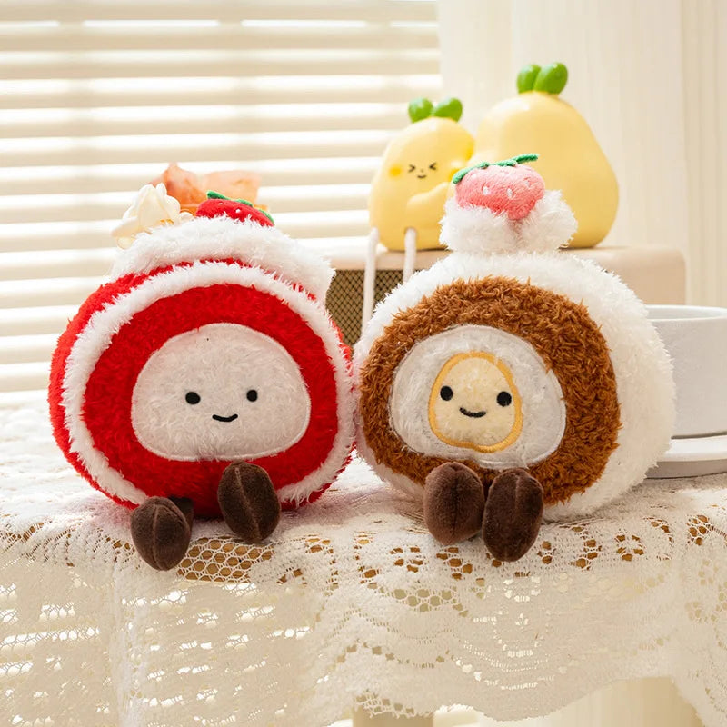 Two kawaii plush toys resembling cake rolls with faces on a lace tablecloth.