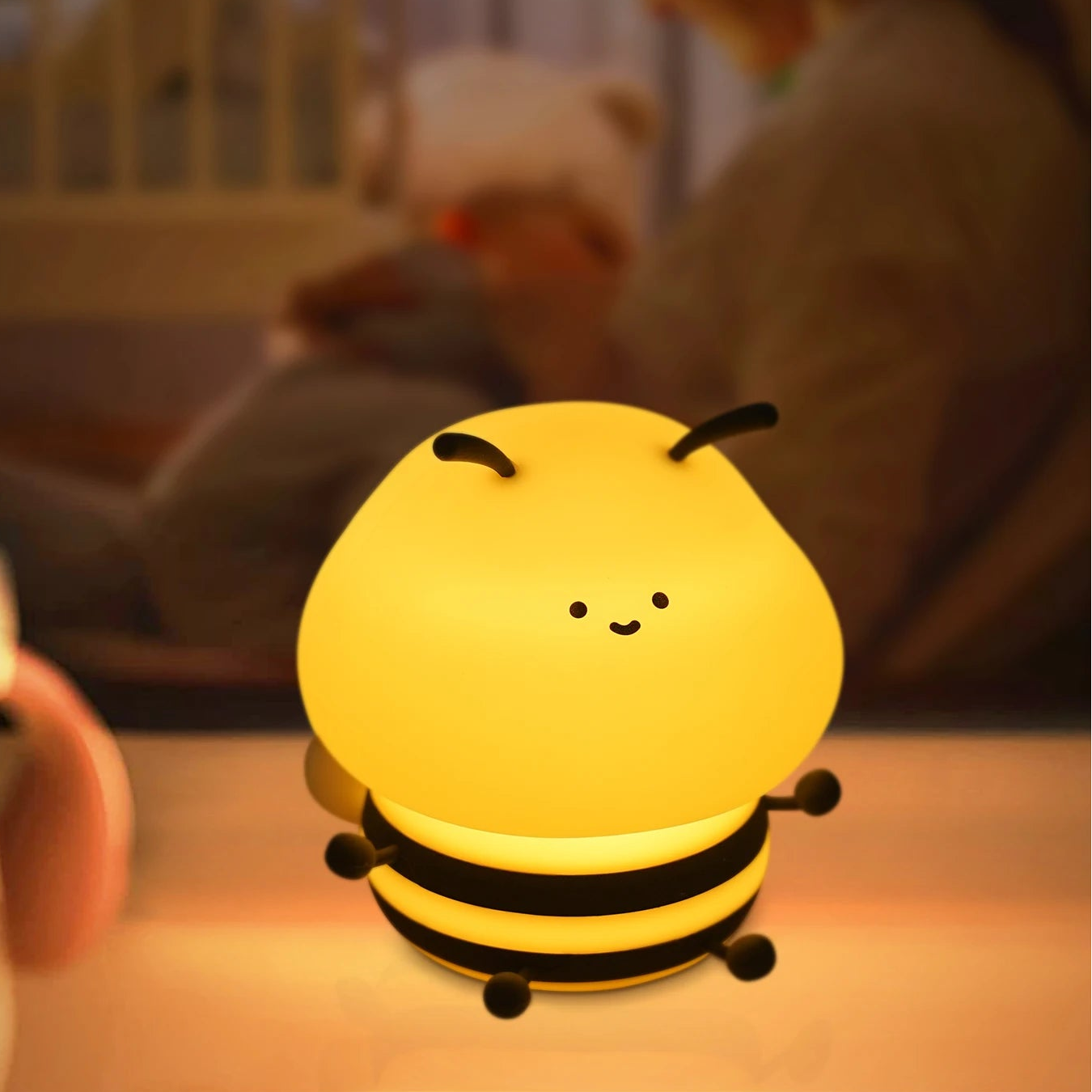 Child's kawaii night light shaped like a bee with text about breastfeeding in the night.