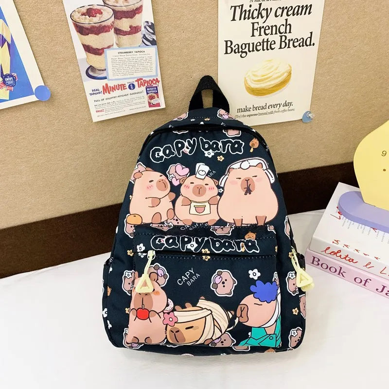 Backpack with Kawaii cartoon character design on a desk with posters in the background