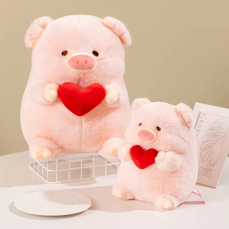 Two pink kawaii plush pigs holding red hearts on a light background