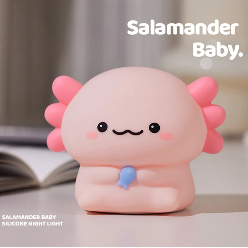 Axolotl-shaped silicone kawaii night light with a pink and blue design on a neutral background.
