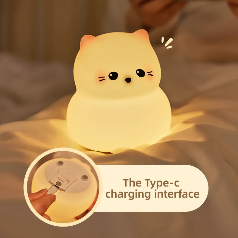 Cat-shaped kawaii night light with text 'Long lasting endurance' and 'Type-c charging interface' on a blurred background.