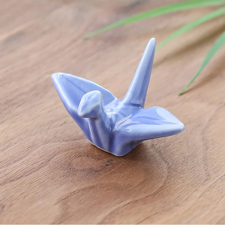 A blue kawaii chopstick holders on a table