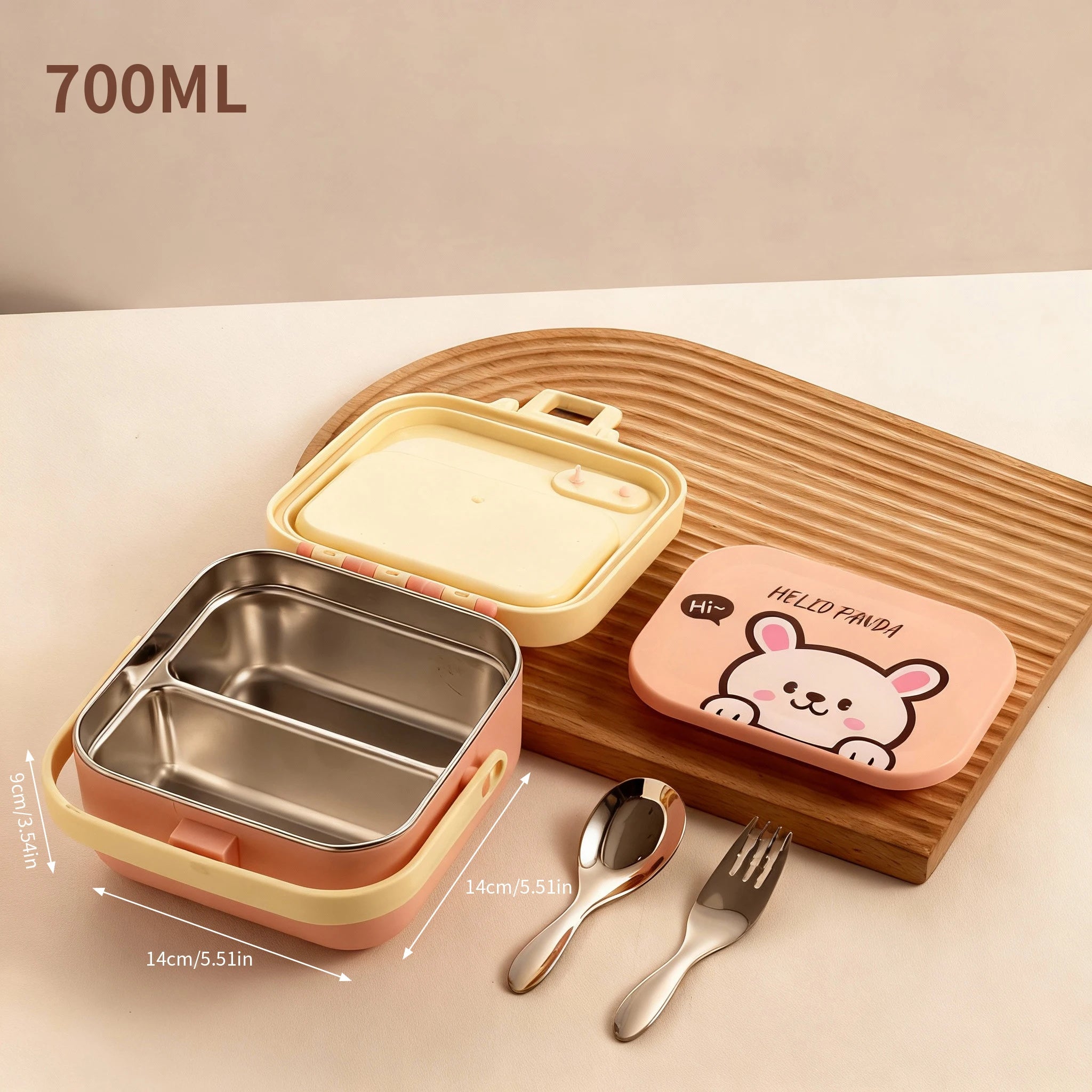 Children's kawaii lunch box set with pink lid, stainless steel compartment, spoon, and fork on a wooden board.