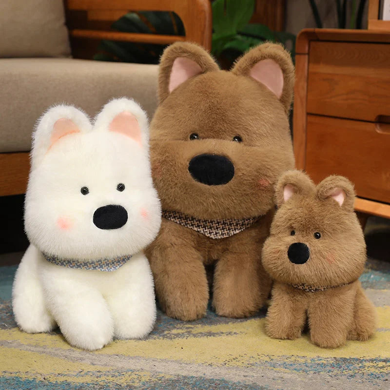 Three stuffed kawaii animals, two brown and one white, sitting on a rug.