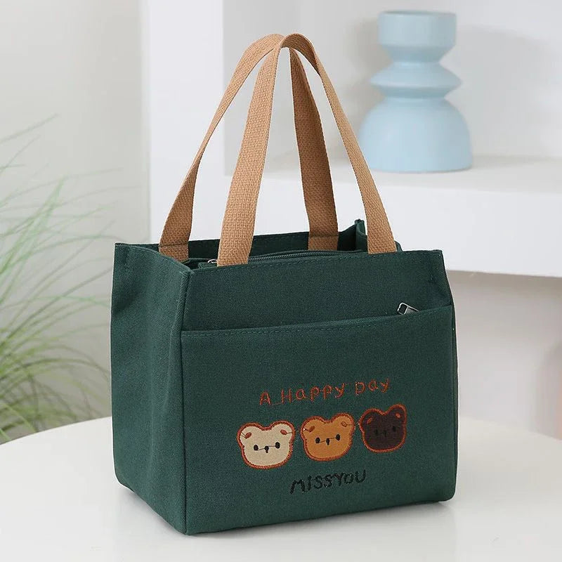 Green kawaii tote bag with bear illustrations and text on a white surface