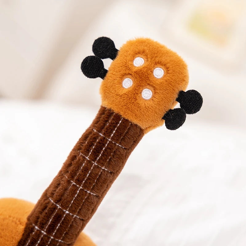 Kawaii plush guitar toy with a blurred background