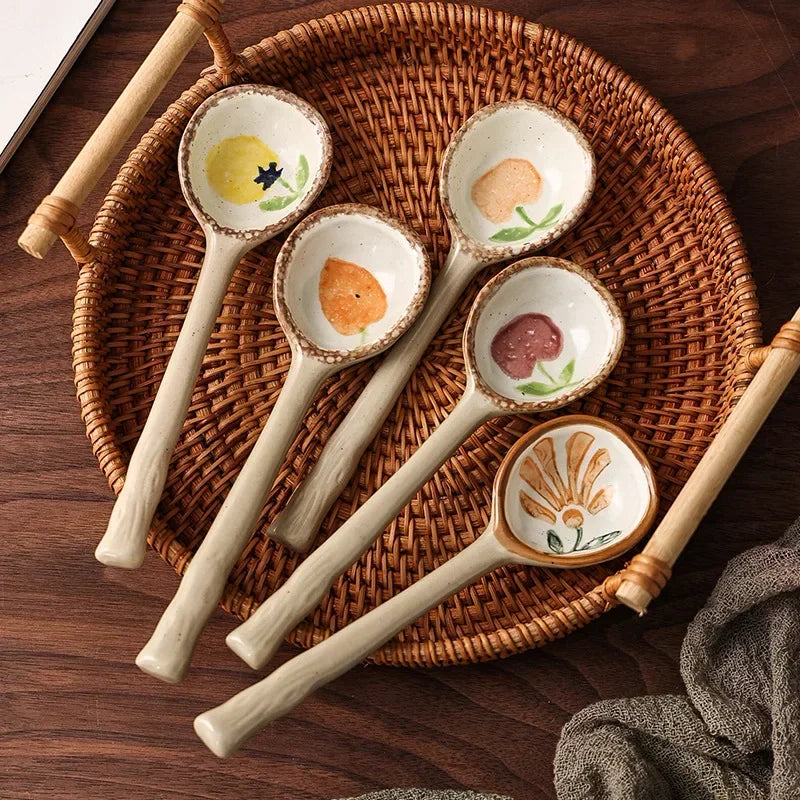 Five kawaii spoons on a woven tray