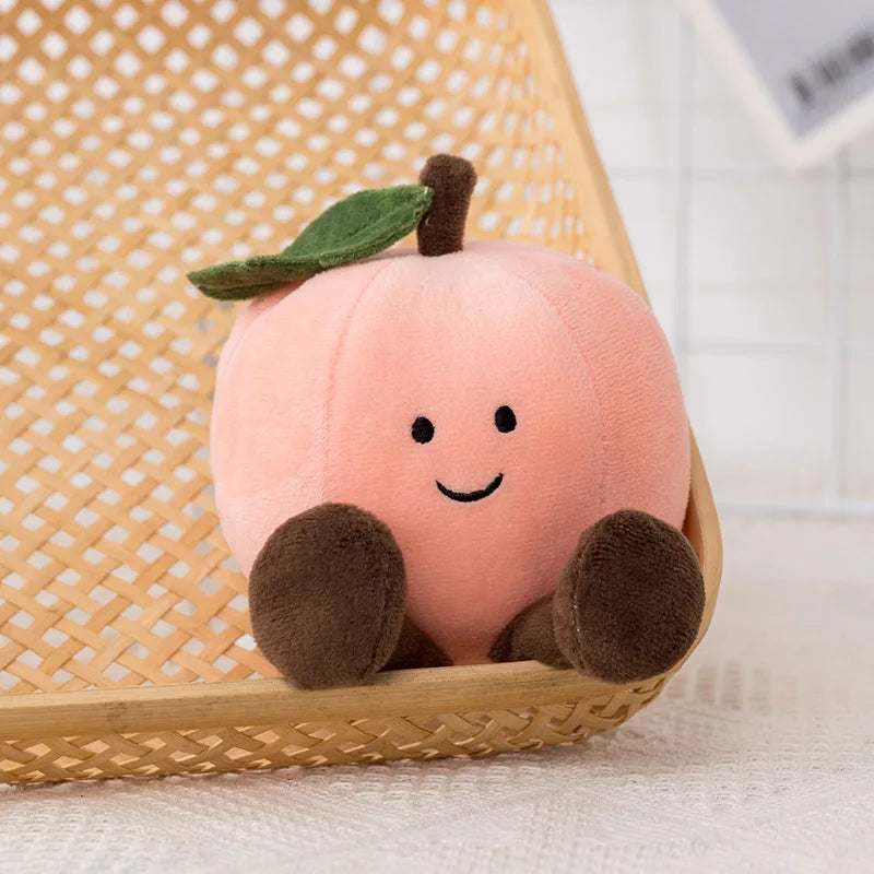 Plush kawaii toy shaped like a peach with a smiling face on a woven chair.