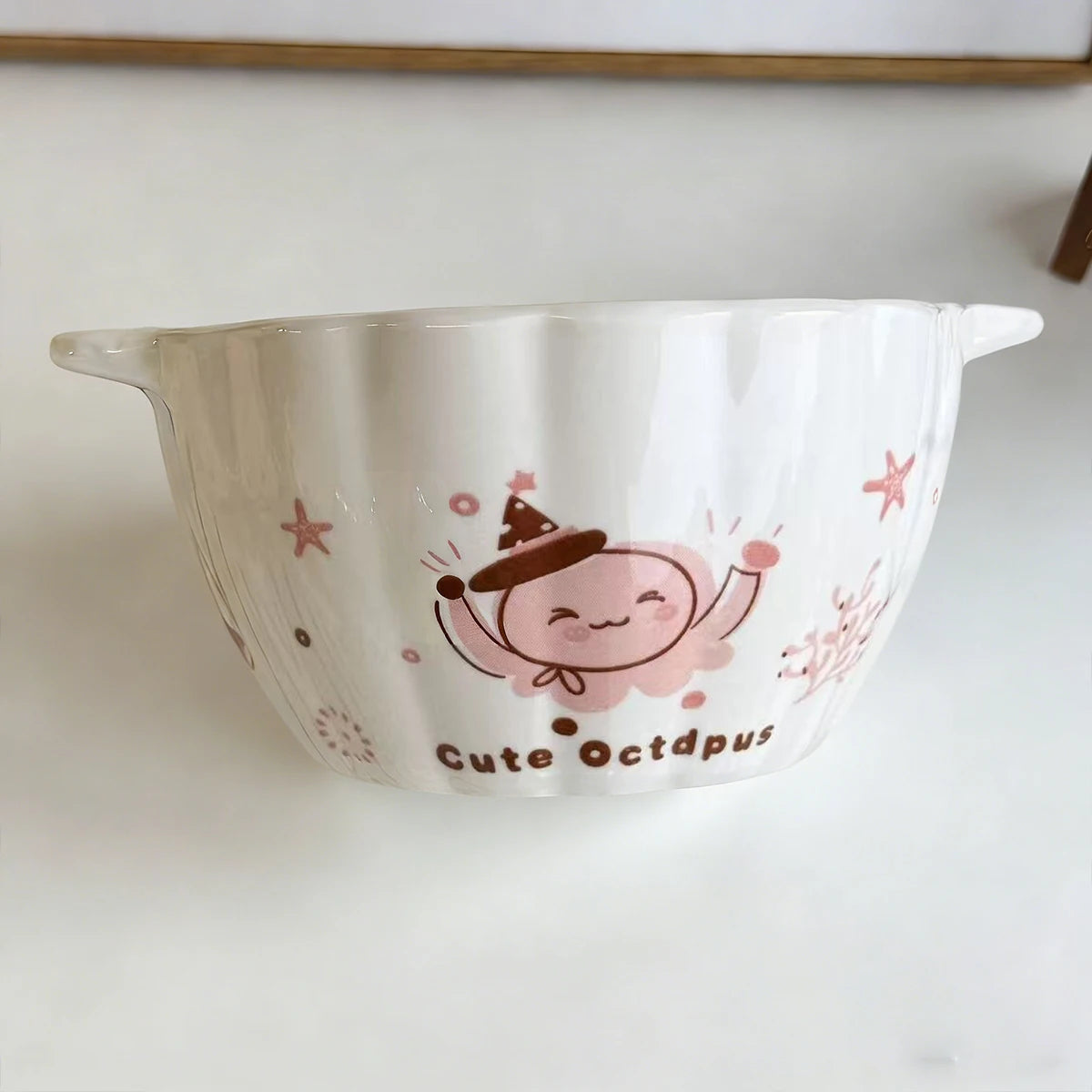 White kawaii ramen bowl with a cute octopus design on a white background