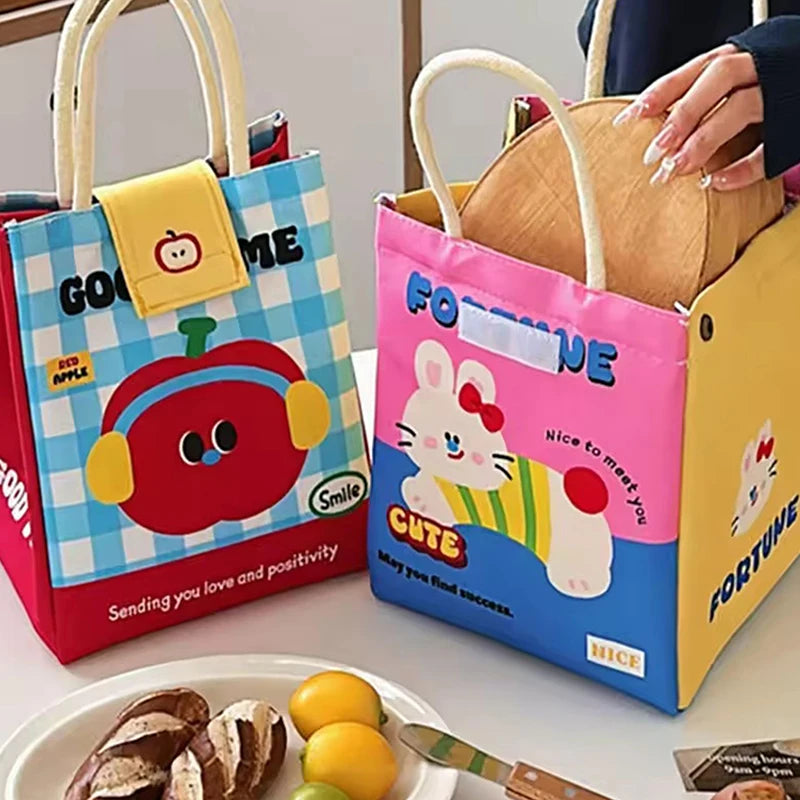 Two colorful children's kawaii bags with cartoon designs on a table.