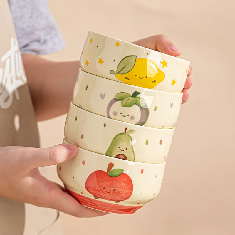 Four kawaii bowls being helf by someone