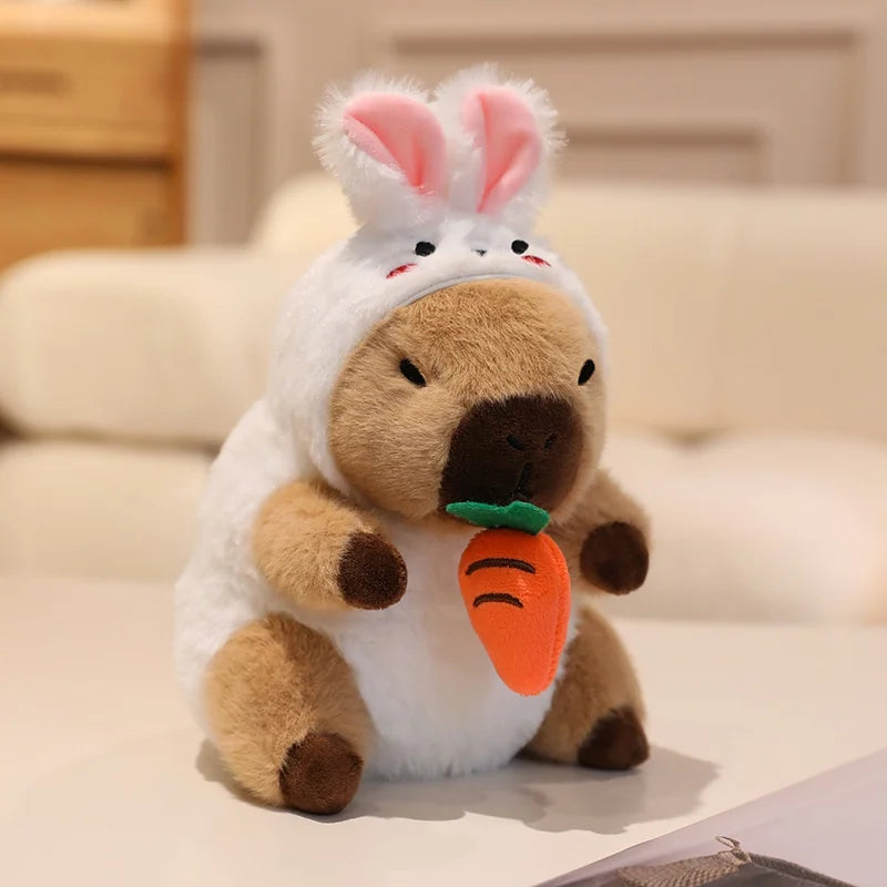 Kawaii plush toy dog in a bunny costume holding a carrot on a light background