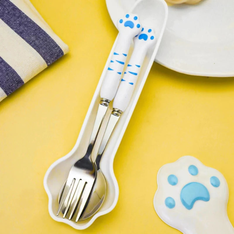 Children's kawaii utensils set with paw print design on a yellow background