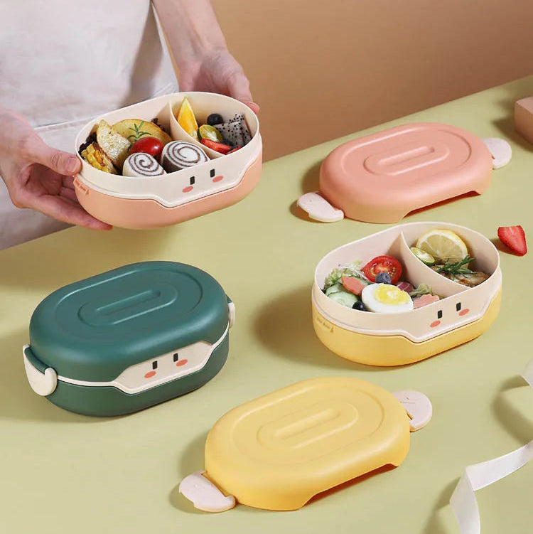 Colorful kawaii bento boxes with food on a light green surface
