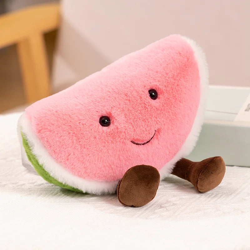 Plush toy shaped like a watermelon slice with a smiling face on a light surface.