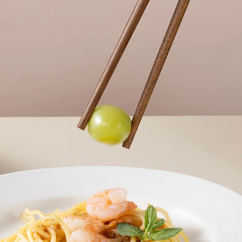 Kawaii chopsticks on a plate of pasta with text overlay