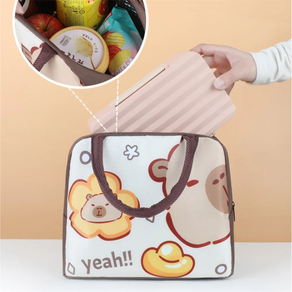 Cartoon-themed kawaii lunch bag with bear design and food items peeking out.