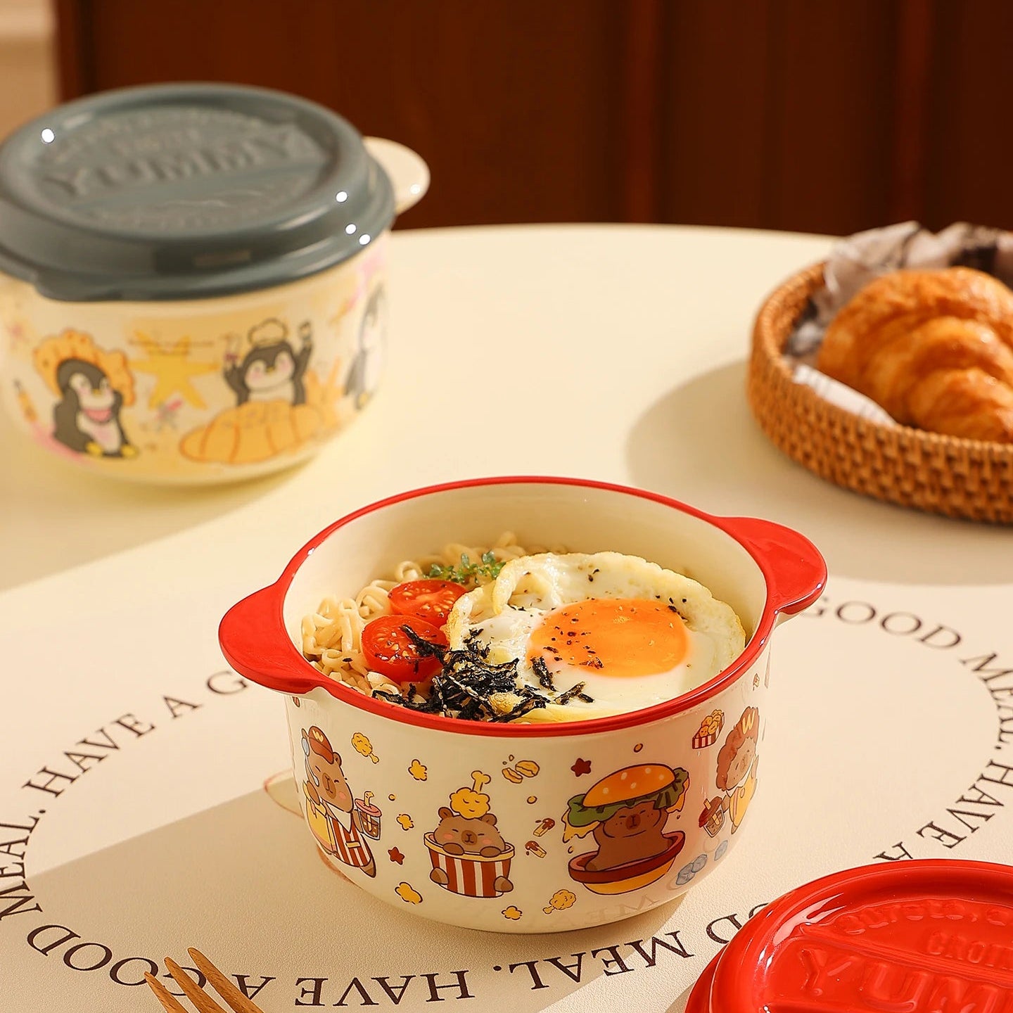 Ceramic kawaii ramen bowls with food on a table
