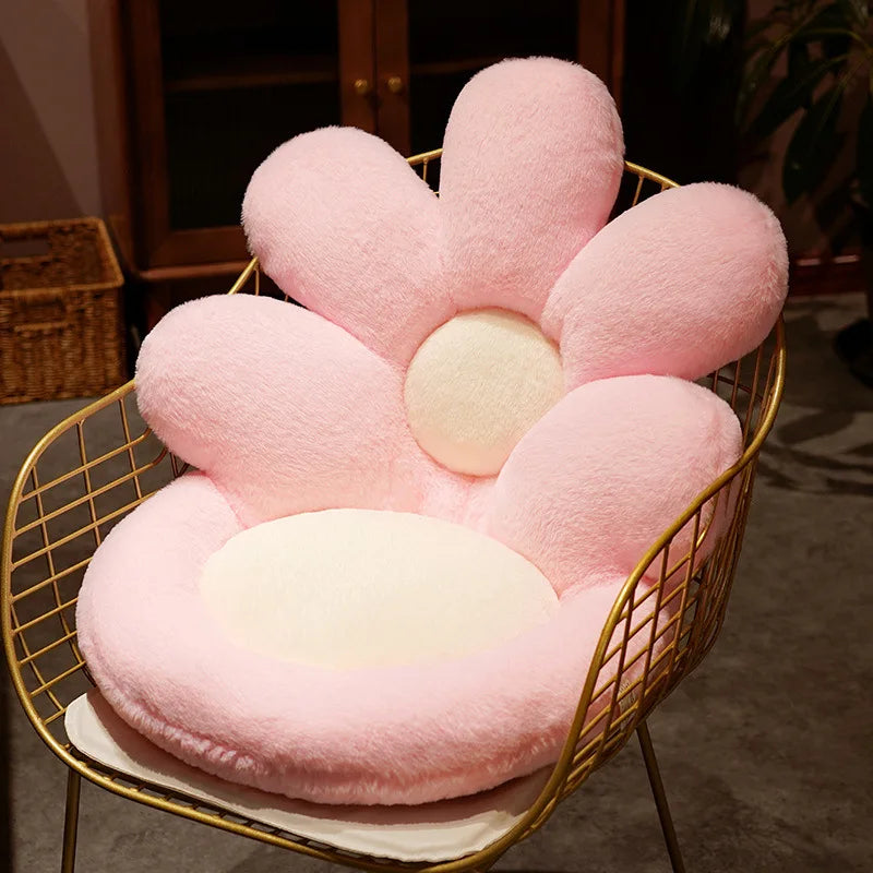 Pink flower-shaped kawaii cushion on a gold wire chair