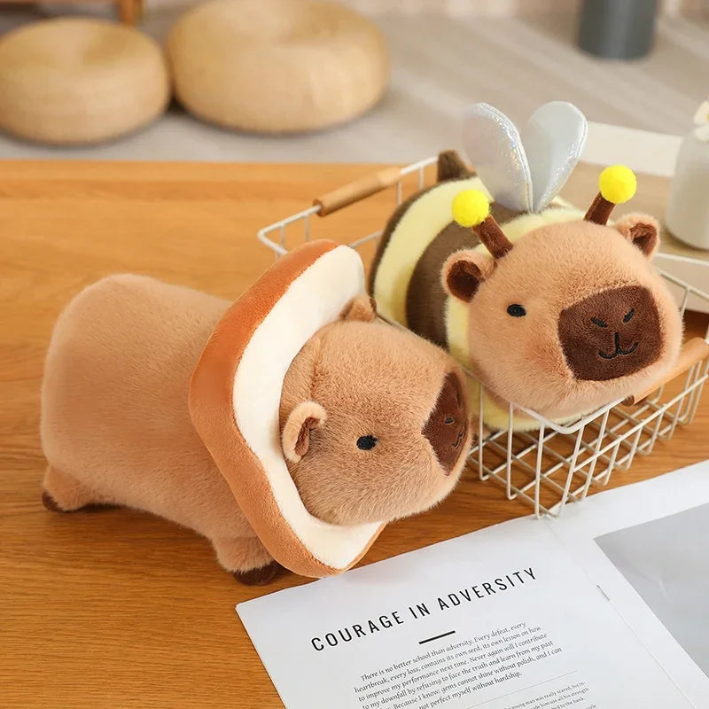 Three kawaii plush toys resembling bears with bee costumes on a wooden surface.