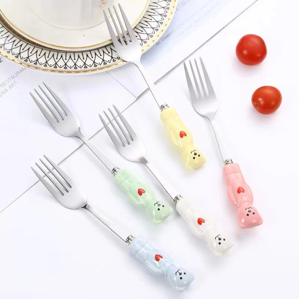 A group of kawaii utensils of various colors sitting on the table
