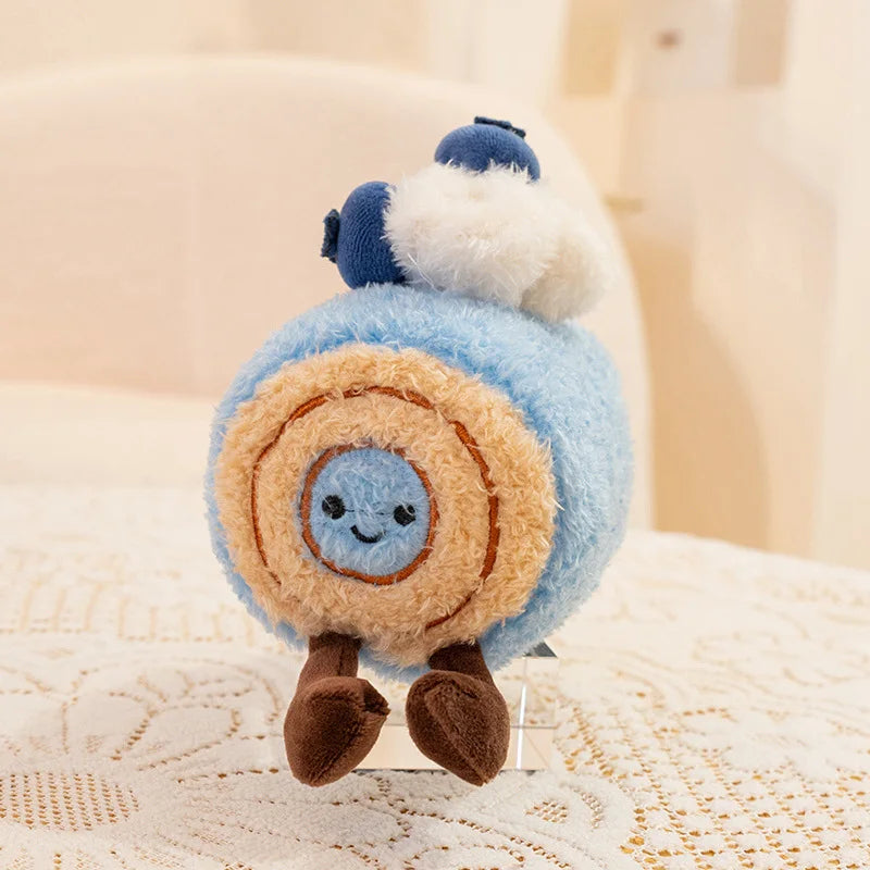 Kawaii plush toy resembling a rolled-up character with a blue face on a textured surface