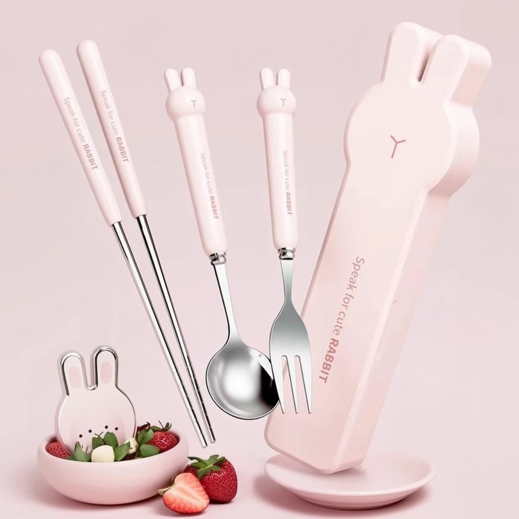 Cute rabbit-themed kawaii utensils set with pink handles on a light pink background