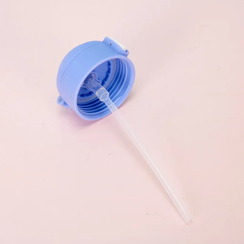 Blue collapsible kawaii tumbler with straw on a light pink background