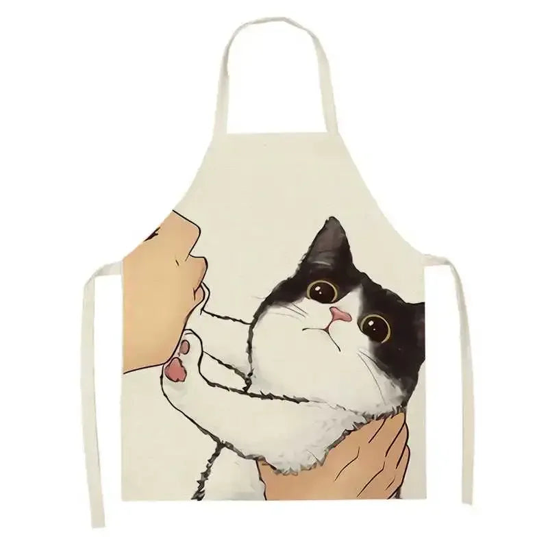 Kawaii apron with a design of a cat being held by a person on a white background