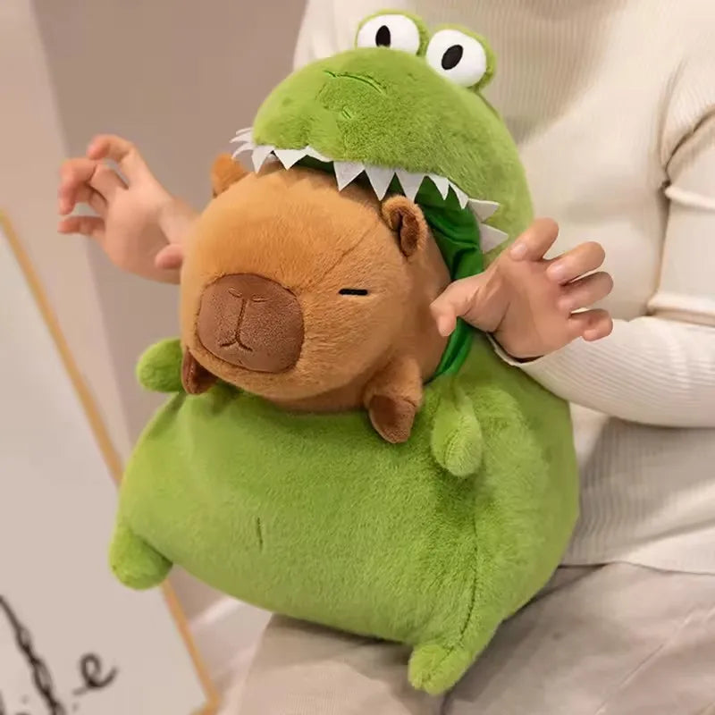 Person holding a green kawaii plush toy with a dinosaur design on a neutral background