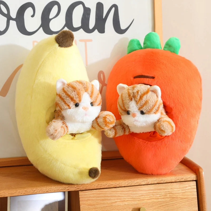 Two kawaii plush toys of a cat in a banana and a carrot on a wooden surface with 'ocean' sign in the background.