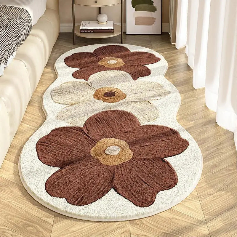 Floral-patterned kawaii rug on a wooden floor with a couch and side table in the background.