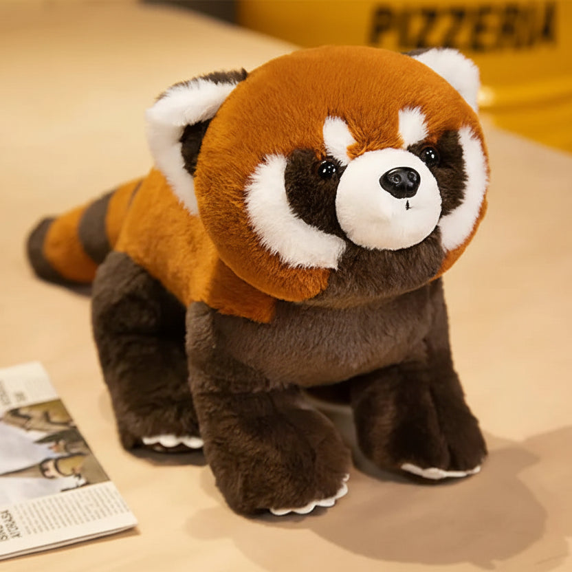 Kawaii plush toy red panda on a beige surface with text indicating size.