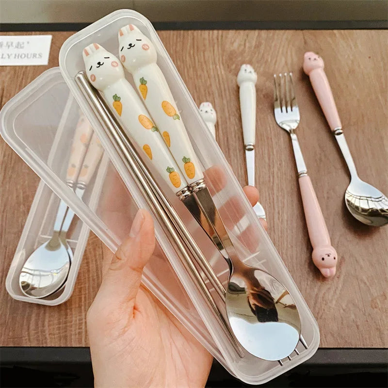 Someone holding rabbie designed kawaii utensils