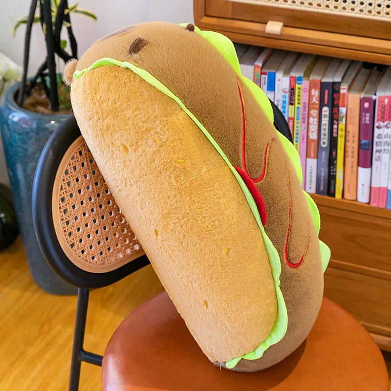 Kawaii plush toy shaped like a hot dog with a Nike logo on a stool in a room with books and a plant.