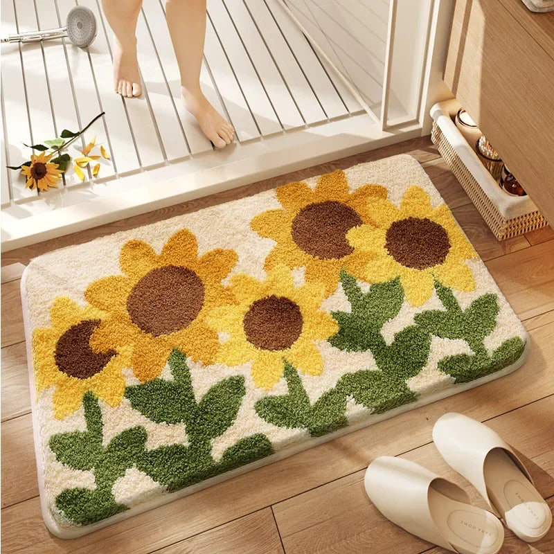 Decorative kawaii bath mat with sunflower design on a wooden floor, with a person stepping onto it.