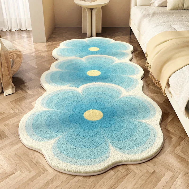 Floral-shaped kawaii rug with blue flowers and yellow centers on a wooden floor.